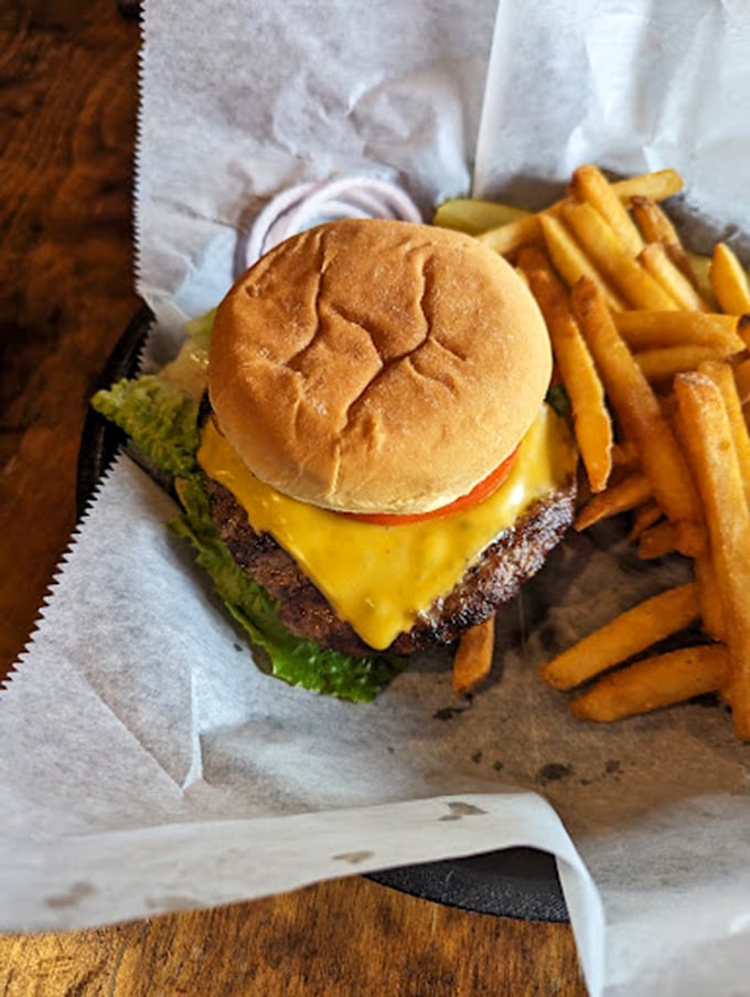 Behold, the classic cheeseburger in its natural habitat. This beauty could make even the Mona Lisa crack a smile.