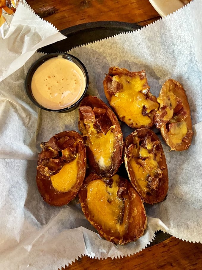 Potato skins: nature's edible spoons. These crispy vessels of cheesy, bacony goodness are like little boats sailing straight to Flavor Town.