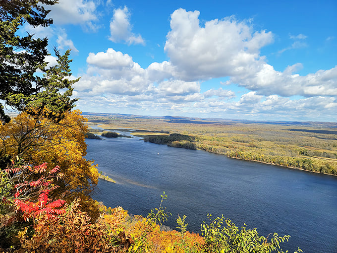 A patchwork of autumn colors blankets rolling hills. Mother Nature's quilt, perfect for wrapping yourself in wonder. Photo credit: Andrew Lemke