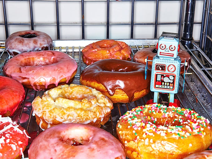 Holy hole-y delights! These donuts aren't just dessert, they're works of art. That little robot? He's the official taste-tester (and my new best friend).