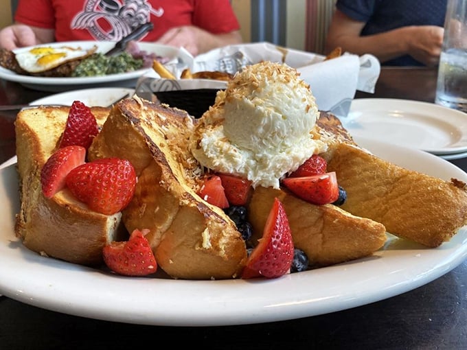 French toast that puts the "ooh la la" in brunch. Topped with fresh berries and a dollop of heaven, it's the breakfast of champions (and very happy food critics).