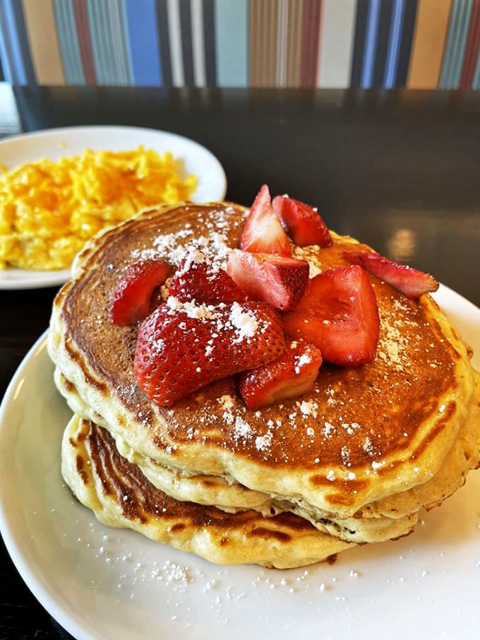 Stack attack! These pancakes are so fluffy, they might float away if it weren't for that delicious strawberry anchor. Syrup is optional, but highly recommended.