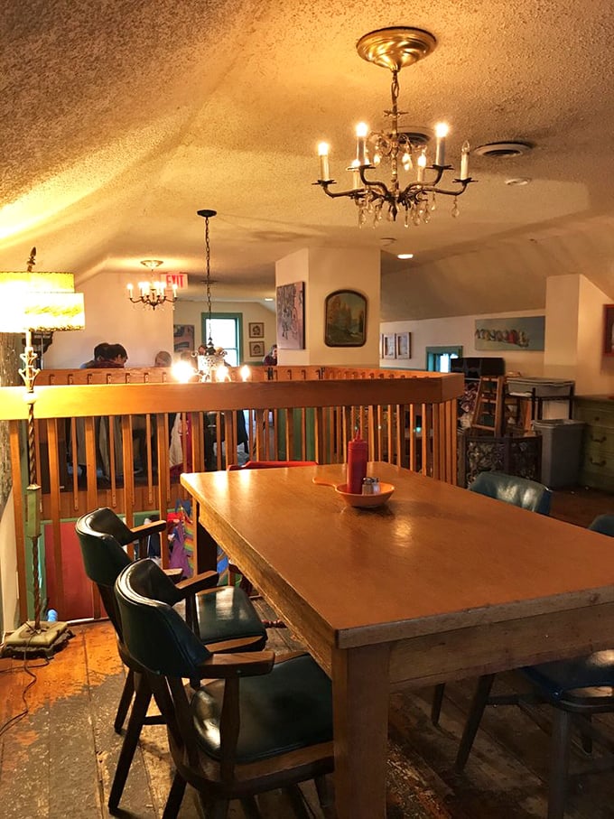 Dining room or time machine? With chandeliers and mismatched furniture, this space feels like your coolest grandma's living room – in the best way possible.