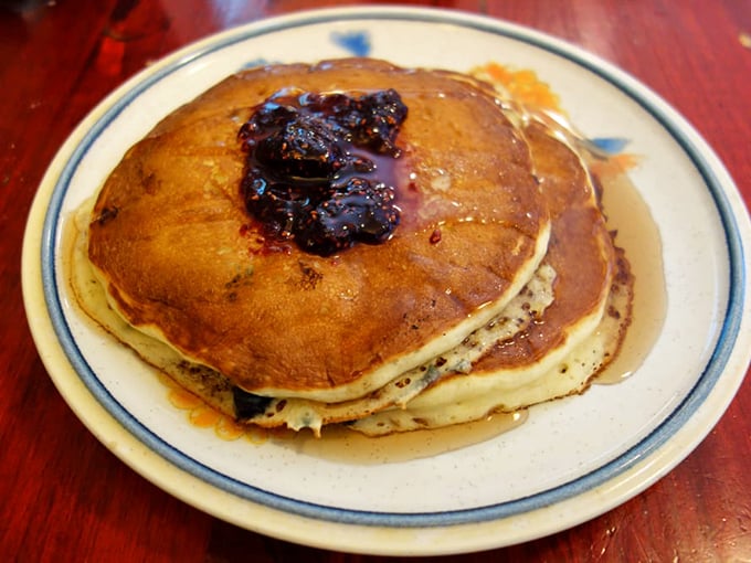 Stack attack! These pancakes are so fluffy, they might float away if it weren't for that delicious-looking berry compote anchoring them down.