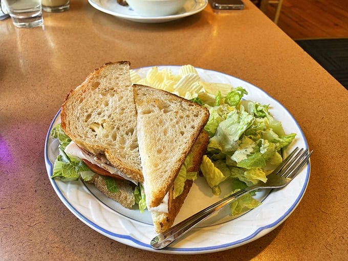 Sandwich goals achieved! This turkey sandwich isn't just lunch, it's a towering monument to the art of stacking deliciousness between bread slices.