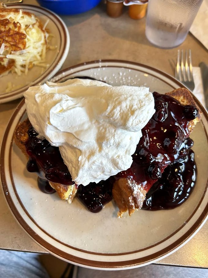 French toast that would make Marie Antoinette say, "Let them eat this instead!" Crowned with berries and cream, it's breakfast fit for royalty – elastic waistbands highly recommended.