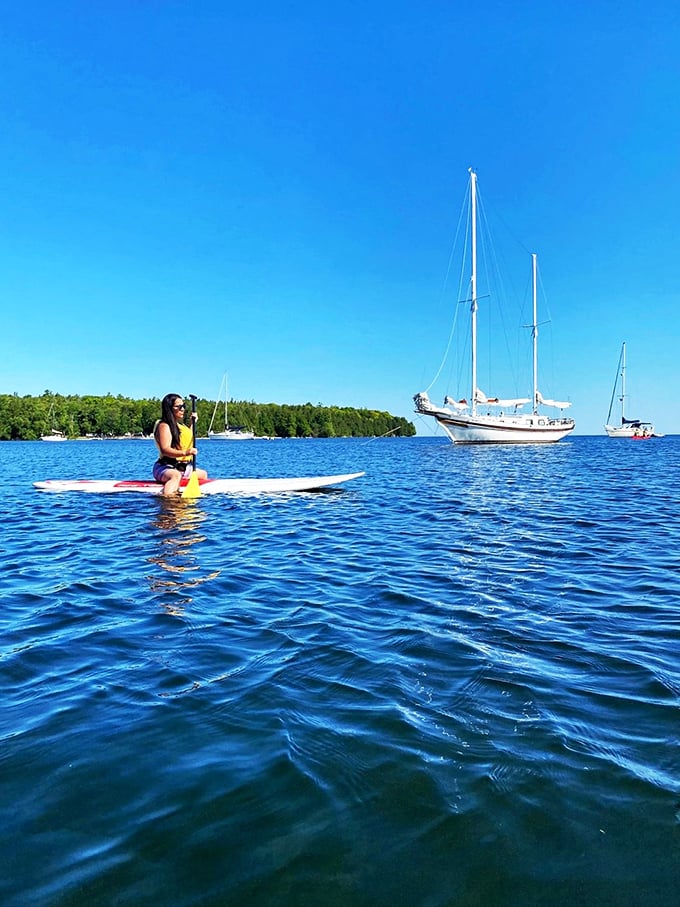 SUP and away! Paddle boarding here is like gliding on nature's mirror. Just don't expect to see your reflection - the view's too distracting.