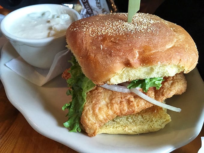 Golden-fried haddock peeks out from a toasted bun, while creamy sauce stands ready for its supporting role.