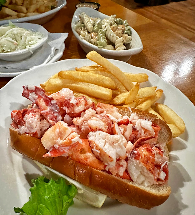 Maine's iconic lobster roll, generously stuffed and simply dressed, proves sometimes less is more when the seafood's this fresh.