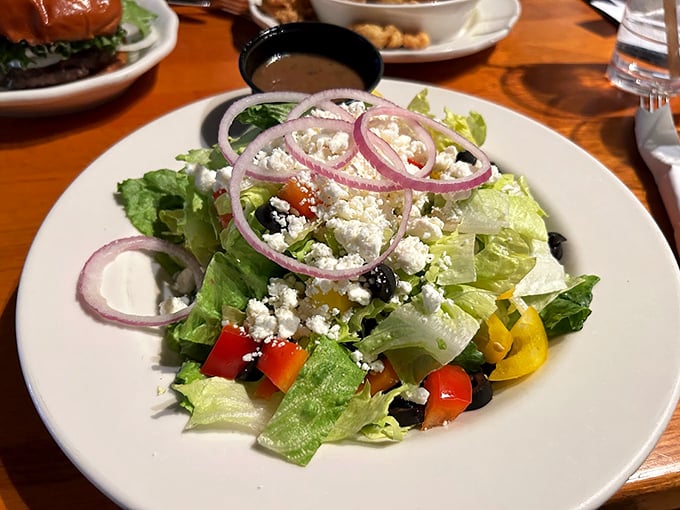 A fresh Greek salad brings Mediterranean flair to Maine's coast, with crisp vegetables and generous feta crumbles.