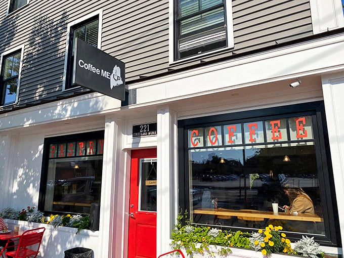 Welcome to caffeine paradise! This charming red door leads to a world where coffee dreams come true.