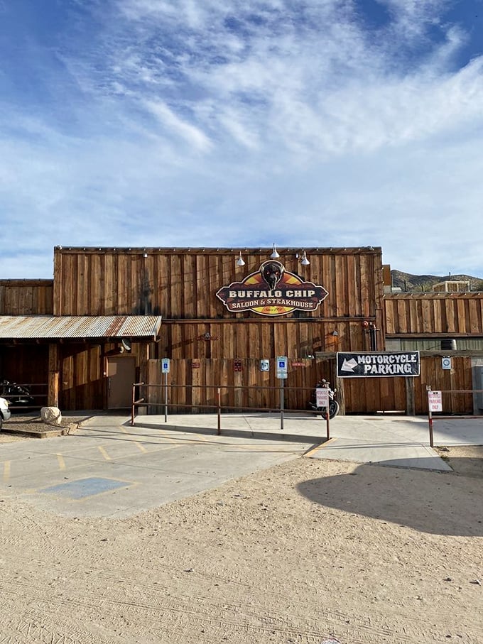 Howdy, partner! This ain't no Hollywood set – it's the real-deal Buffalo Chip Saloon, where the Old West lives on in all its wooden glory.