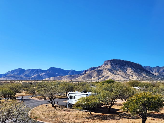 Desert oasis: RV camping with a stunning mountain backdrop at Kartchner Caverns State Park, Arizona. Where adventure meets comfort under endless blue skies.