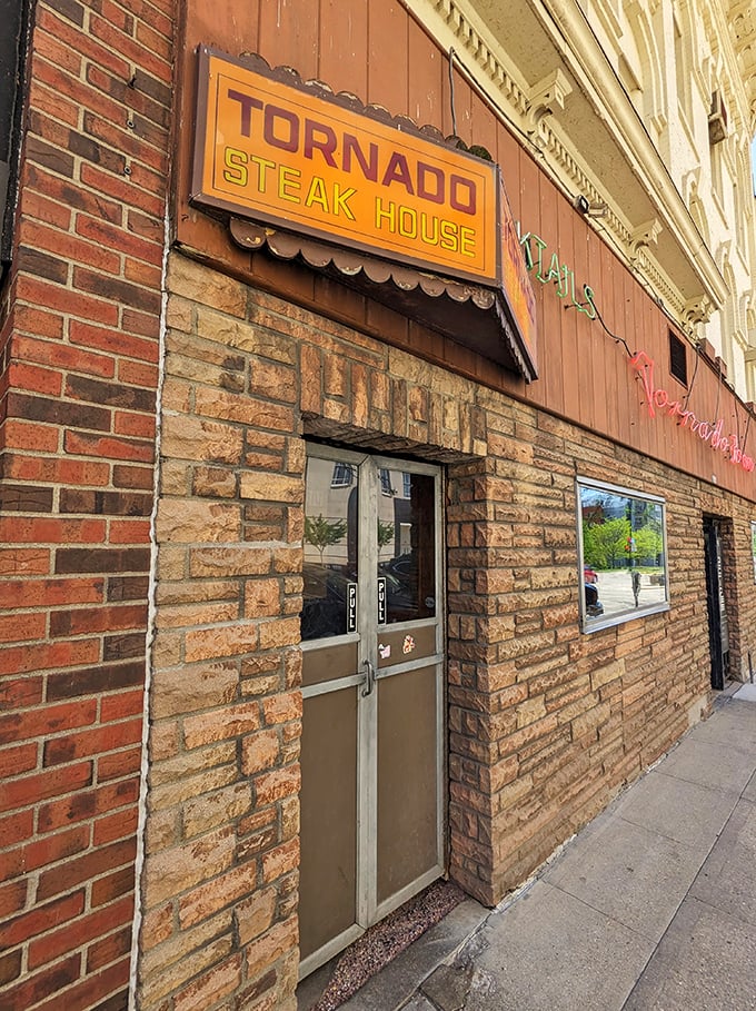 Step into a time warp! The Tornado Room's retro sign promises a whirlwind of flavor and nostalgia. It's like Mad Men, but with better steaks.