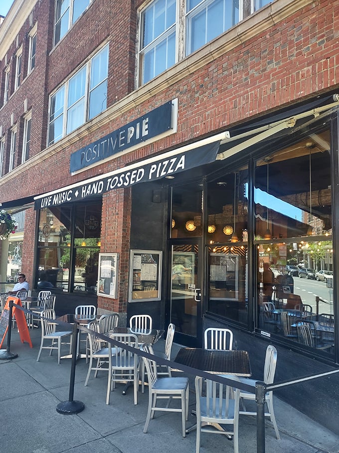 Brick and mortar never looked so inviting! Positive Pie's storefront promises hand-tossed pizza and live music – a feast for all senses.