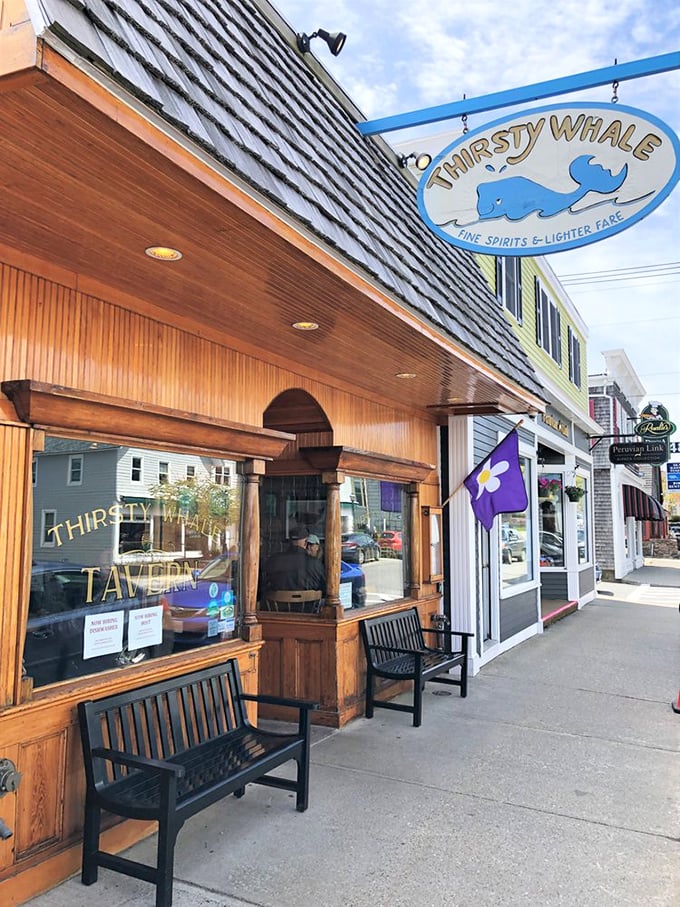 A charming slice of coastal Maine welcomes you with weathered shingles and a playful whale sign, promising fine spirits and lighter fare.