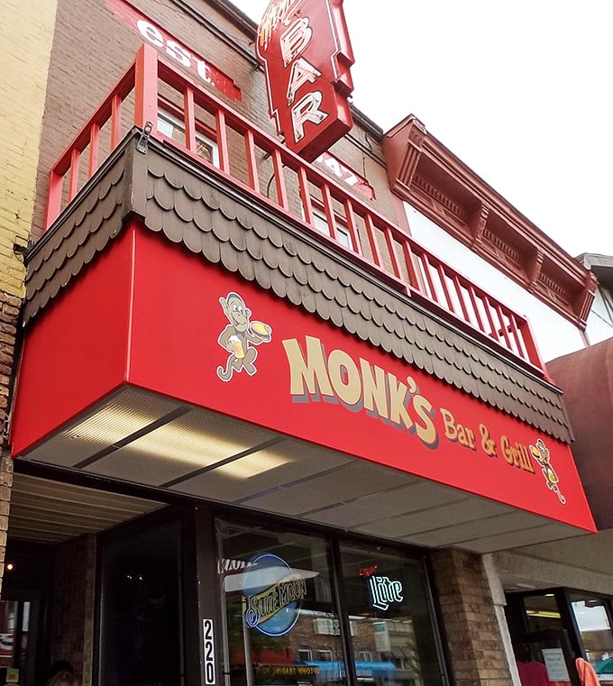 Welcome to flavor town! Monk's Bar & Grill's vibrant red awning and cheeky monkey mascot beckon you into a world of Wisconsin comfort food and charm.