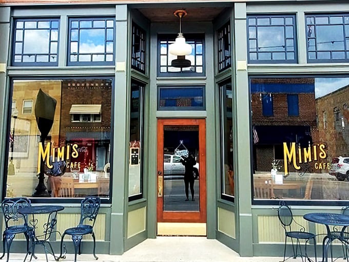 Step into a slice of small-town charm! Mimi's Cafe's sage-green facade and inviting windows promise a cozy retreat from the hustle and bustle.