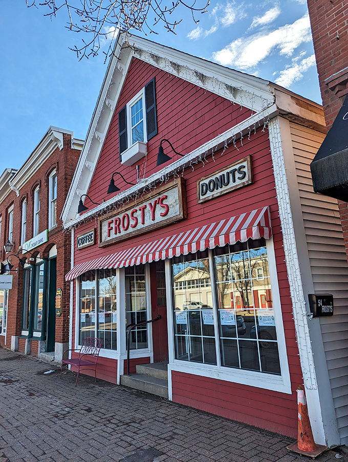 Welcome to donut paradise! Frosty's coral exterior and striped awning beckon like a siren's call to sweet-toothed sailors.