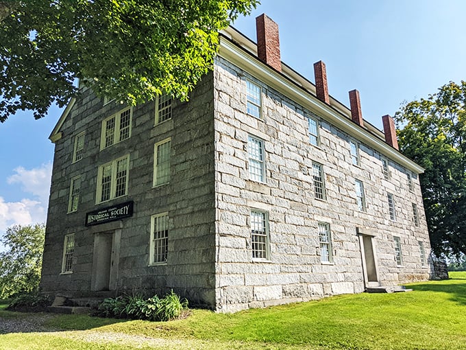 A stone fortress of knowledge! This grand edifice stands tall, its granite walls whispering tales of centuries past. It's like Hogwarts for history buffs, minus the moving staircases.