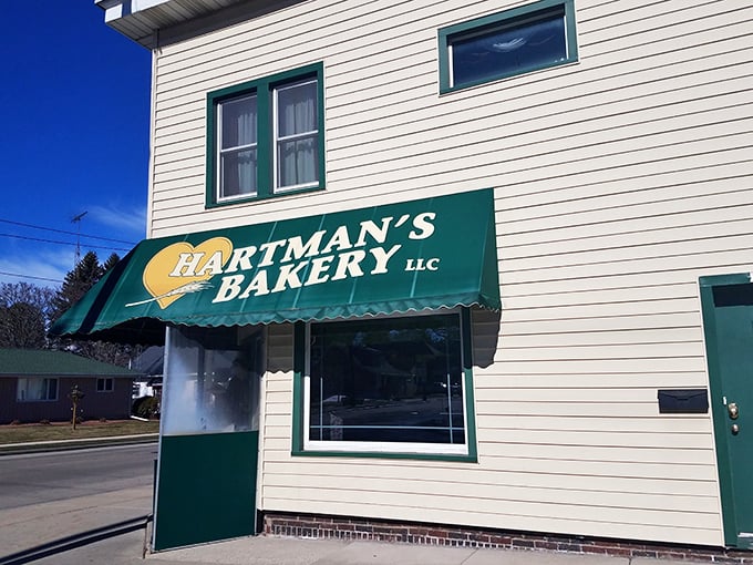 A slice of Americana with a side of sugar! Hartman's Bakery's charming exterior promises sweet delights within, like a real-life Willy Wonka factory in small-town Wisconsin.