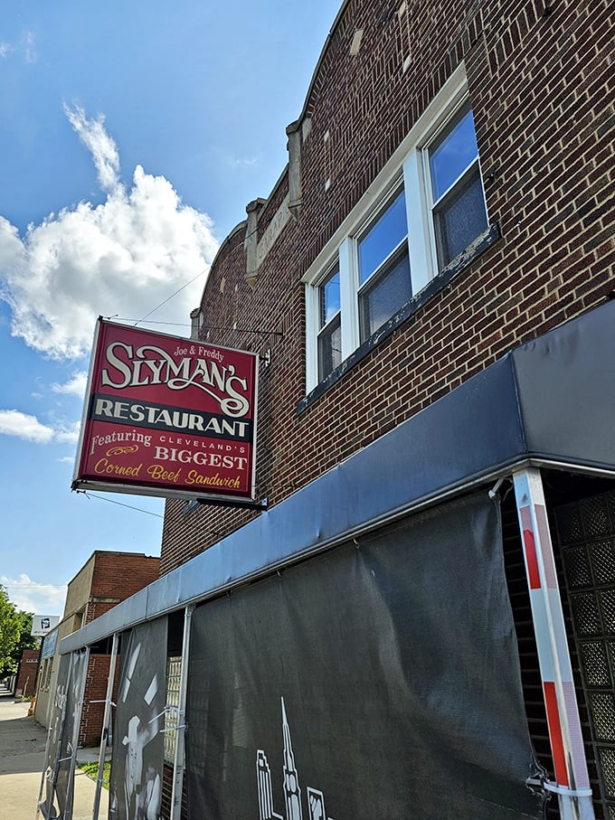 Welcome to sandwich paradise! Slyman's iconic red sign beckons like a meaty lighthouse, guiding hungry souls to corned beef nirvana.