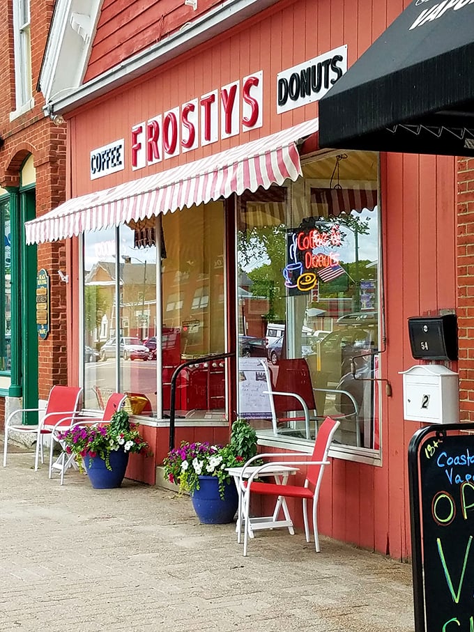 Welcome to donut paradise! Frosty's coral exterior and striped awning beckon like a siren's call to sweet-toothed sailors.