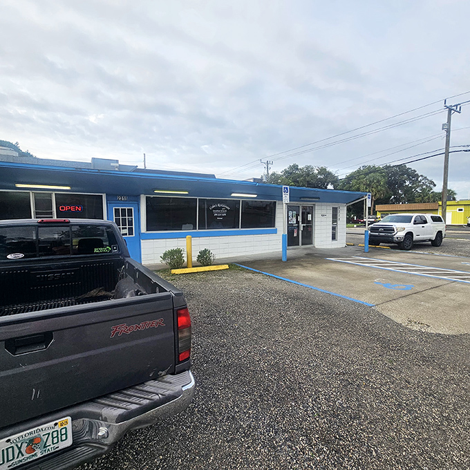 Blue skies and comfort food await! This unassuming exterior hides a treasure trove of culinary delights that'll make your taste buds do a happy dance.