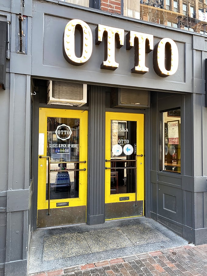 Welcome to OTTO, where the bright yellow doors are like a beacon guiding pizza lovers home. This Portland hotspot is serving up slices of heaven with a side of urban charm.