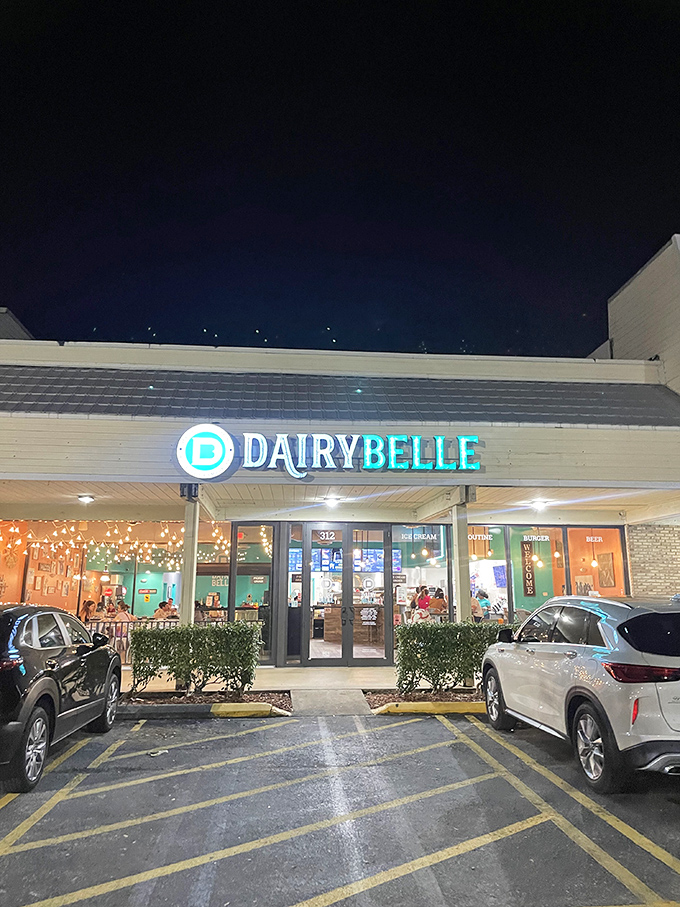 Dairy Belle's neon sign beckons like a lighthouse for the hungry. This retro-chic oasis promises a journey back to simpler, tastier times.