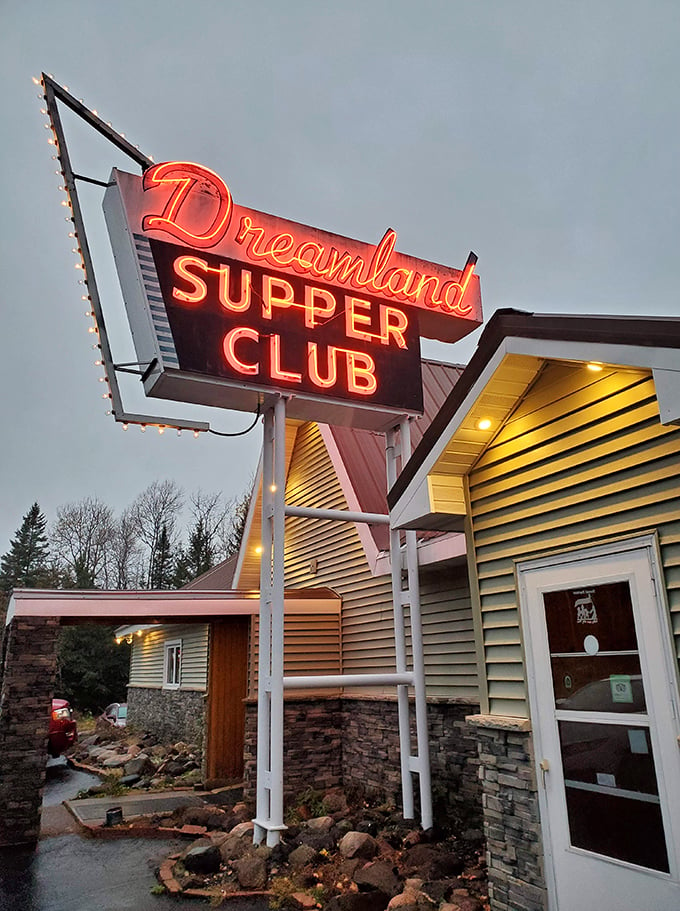 Neon dreams come true! Dreamland Supper Club's vintage sign beckons like a lighthouse for the hungry, promising a voyage through Wisconsin's culinary past.