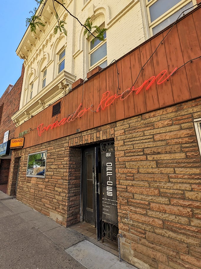 Step into a time warp! The Tornado Room's retro sign promises a whirlwind of flavor and nostalgia. It's like Mad Men, but with better steaks.