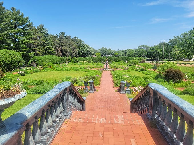 A red-brick path to paradise! This grand entrance to Munsinger Gardens promises a floral adventure that'll make your Instagram followers green with envy.