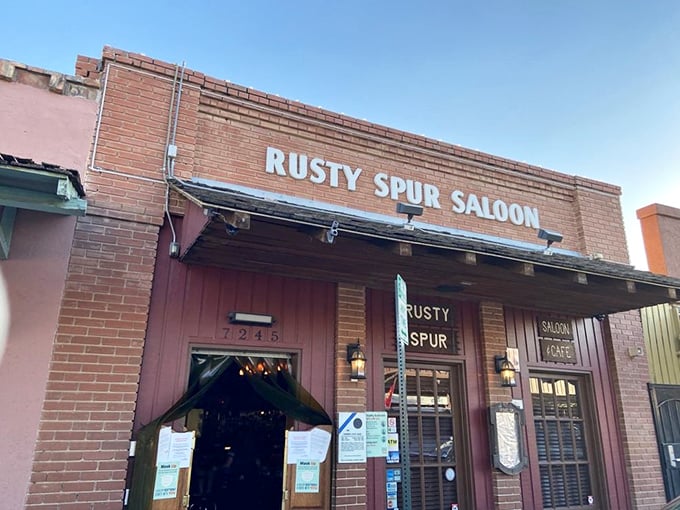 Step right up to the Rusty Spur Saloon, where the Old West isn't just alive—it's serving drinks! This brick facade promises more stories than a cowboy's campfire.