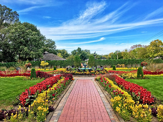 A red-brick path to paradise! This grand entrance to Munsinger Gardens promises a floral adventure that'll make your Instagram followers green with envy.