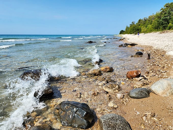 Nature's own rock concert! Waves crash against a symphony of stones, creating a beachcomber's paradise that would make even the Rolling Stones jealous.