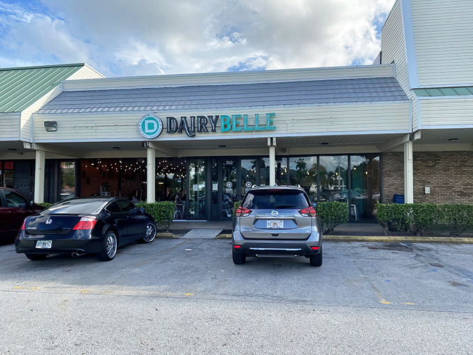 Dairy Belle's neon sign beckons like a lighthouse for the hungry. This retro-chic oasis promises a journey back to simpler, tastier times.