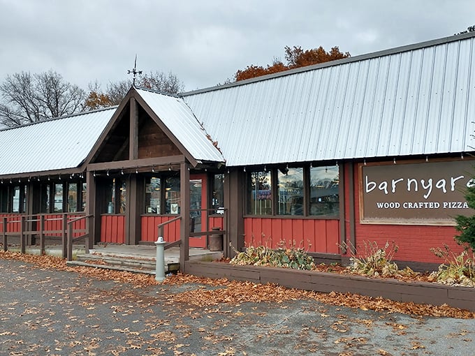 A rustic red barn meets cozy diner? Barnyard Wood Crafted Pizza's exterior promises a feast that's anything but farmyard fare!