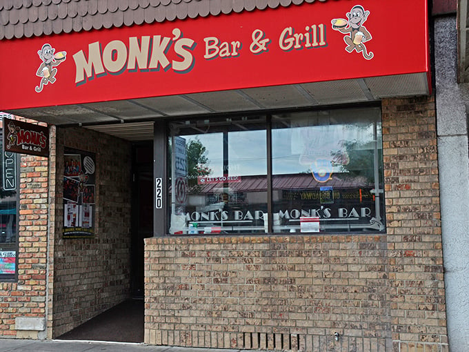 Welcome to flavor town! Monk's Bar & Grill's vibrant red awning and cheeky monkey mascot beckon you into a world of Wisconsin comfort food and charm.