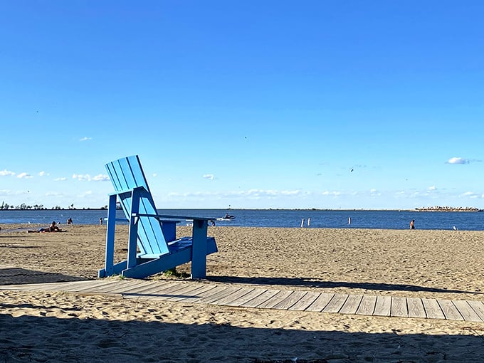 "Who needs a tropical getaway? This giant blue chair is your ticket to relaxation, Ohio-style. Just don't forget your sunscreen – Lake Erie doesn't mess around!"