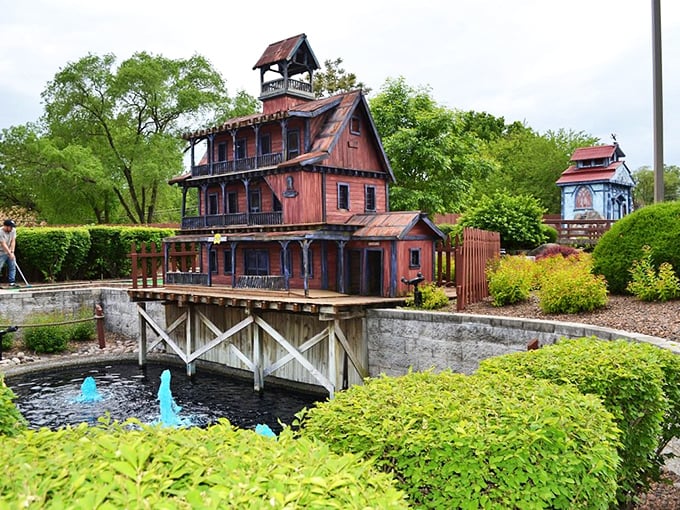 "Welcome to Haunted Trails, where spooky meets silly! This whimsical haunted house looks like Tim Burton's vacation home, complete with a moat for those pesky vampire ducks."