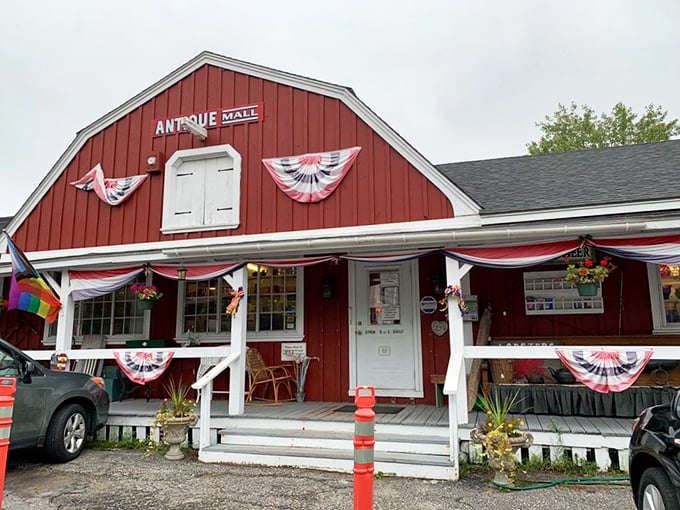 A barn-red beacon of nostalgia! This antique mall looks like it's been plucked straight from a Norman Rockwell painting, complete with a welcoming porch and patriotic flair.