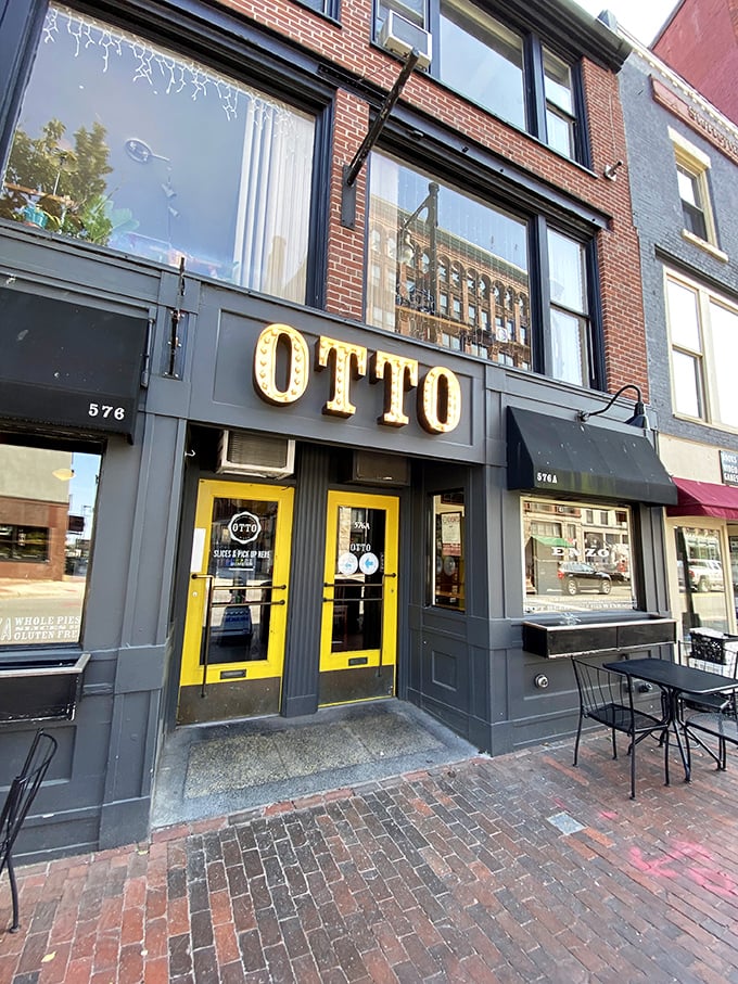 Welcome to OTTO, where the bright yellow doors are like a beacon guiding pizza lovers home. This Portland hotspot is serving up slices of heaven with a side of urban charm.