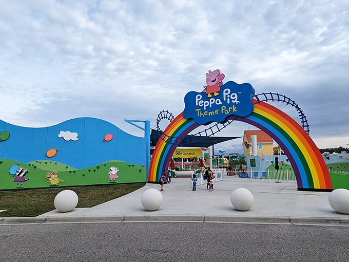 Oink-credible entrance! Peppa's rainbow gateway promises more joy than a muddy puddle on a rainy day.