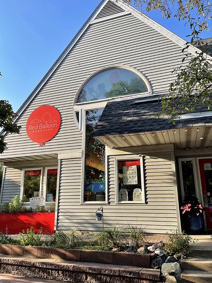 A storybook come to life! Red Balloon's charming facade invites readers to float away on literary adventures, no helium required.