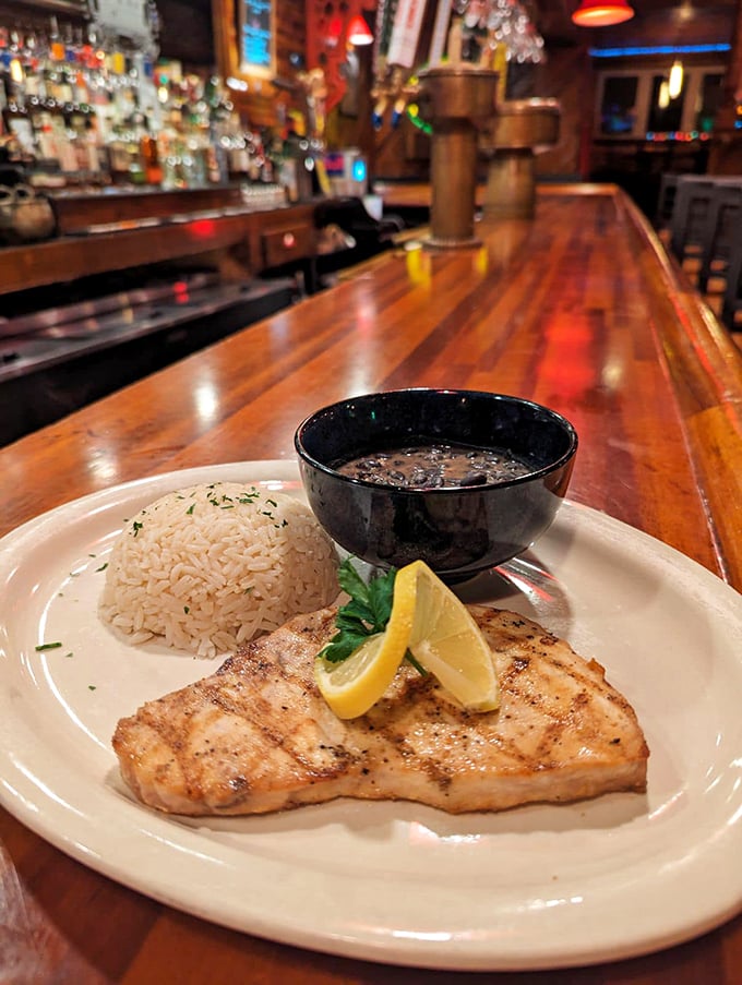 Ahoy, seafood lovers! This grilled swordfish is so fresh, it might just swim off your plate. A lemon butter sauce adds a zesty zing to every bite. Photo credit: Casey's Caboose