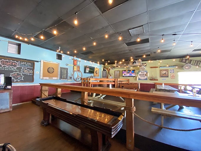 Step into a world where string lights meet shuffleboard. It's like your coolest friend's garage got a glow-up and learned to pour perfect pints. 