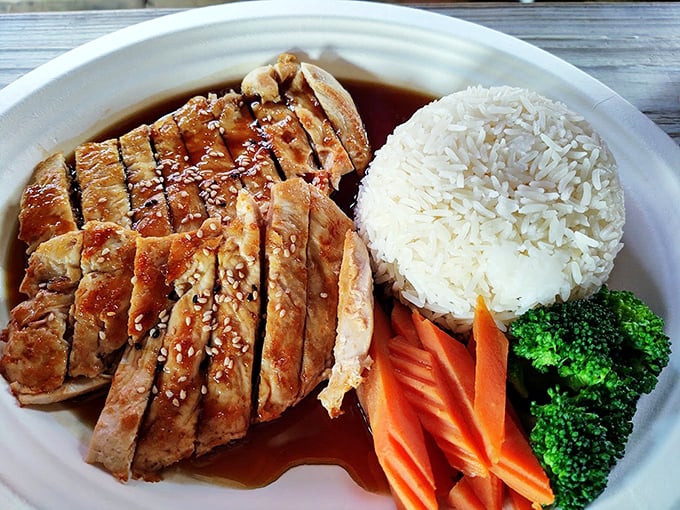 Behold, the chicken that decided to take a luxurious bath in teriyaki sauce. It's glistening like a Florida retiree after a day at the beach. 