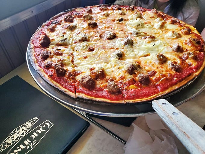 Sausage and onion pizza that's a symphony of flavors. Each bite is a harmonious blend of savory and sweet, like a well-orchestrated Italian opera.