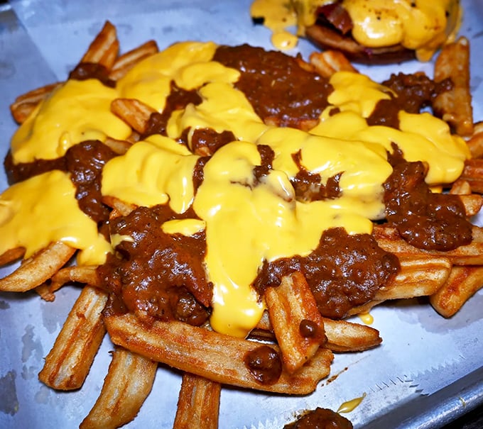 Behold, the Mona Lisa of munchies! These chili cheese fries are a masterpiece that would make even da Vinci's mouth water.